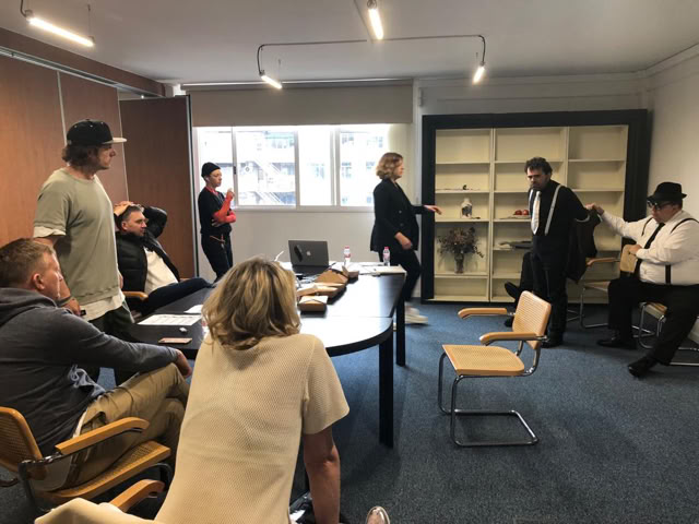 Costume fitting and rehearsal on the office set