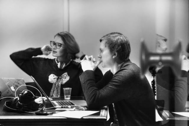 Dasha and Miguel at work, black-and-white