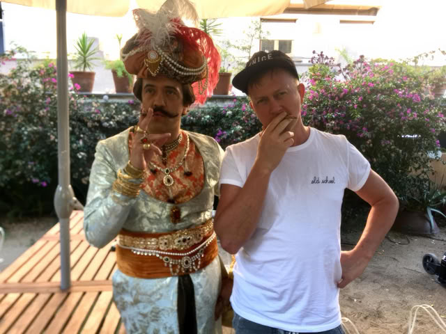 Miguel on set with an actor in a sultan costume